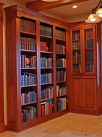 Thumb misc  traditional style  western maple  medium color  raised panel  library  office  open bookcase  metal grill panel  flutes  onlays  raised panel ends   7 crown  standard overlay