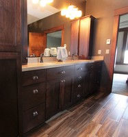 Thumb vanity  craftsman style  hard maple  dark color  recessed panel  bank of drawers  towers  linen  full overlay