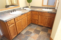 Thumb vanity  craftsman style  knotty alder  medium color  recessed panel  double sinks  master bath  standard overlay