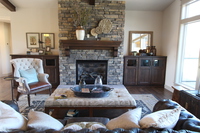 Thumb great room  craftsman style  clear alder  dark color  recessed panel  mantel  glass on top of doors  base cabinets with wood tops  fireplace mantel with corbels  full overlay