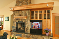 Thumb great room  traditional style  red birch  light color  raised panel  entertainment center  off center fireplace  mantel  carved onlays. craftsman glass grid doors  standard overlay