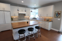 Thumb kitchen  contemporary style  painted  slab door  wood island top  corner sink  retro  all one height  full overlay