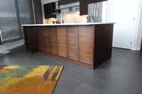 Thumb kitchen  contemporary style  quartersawn walnut  dark color  banded door  frameless construction 