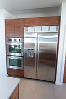 Thumb kitchen  contemporary style  walnut  medium color  banded door  frameless construction  lift up door above the refrigerator  horizontal grain match