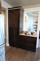 Thumb kitchen  contemporary style  walnut  recessed panel  coffee bar area  pantry cabinet  full overlay  bank of drawers  5 piece drawer fronts