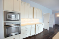 Thumb kitchen  shaker style  painted  recessed and wainscot panel doors  staggered heights  double ovens  bumped out cabinet depth  microwave and oven cabinet  full overlay 