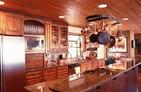 Thumb kitchen  traditional style  knotty alder  medium color  glazed  accent color crown  raised panel doors  recessed panel drawers  appliance garage  standard overlay   