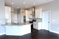 Thumb kitchen  traditional style  painted oak  recessed panel  glazed  chimney hood   angled peninsula  standard overlay