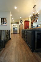 Thumb kitchen  traditional style  painted  recessed and raised panel doors  sand through  red  black and white painted  tall cabinet  spice pull outs next to referigerator  standard overlay