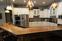 Thumb kitchen  traditional style  painted  recessed panel doors  accent color  black or grey  island  wood top  full overlay
