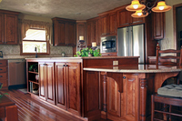 Thumb kitchen  traditional style  red birch  dark style  raised panel island with posts and bar supports  standard overlay