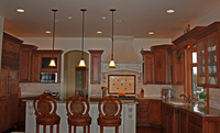 Thumb kitchen  traditional style  western maple  cherry color perimeter  raised panel  accent painted island   custom wood  island overhang  valance  glass doors  flutes  legs  posts  micro in upper  standard overlay