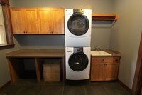 Thumb laundry or utility  shaker style  western maple  medium color  recessed panel  top only  dry rod  stacked washer and dryer  no crown  full overlay