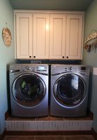 Thumb laundry or utility  traditional style  painted with glaze  recessed panel   6 crown  upper above washer dryer  standard overlay